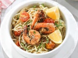 Image shows easy to make shrimp and tomato pasta.