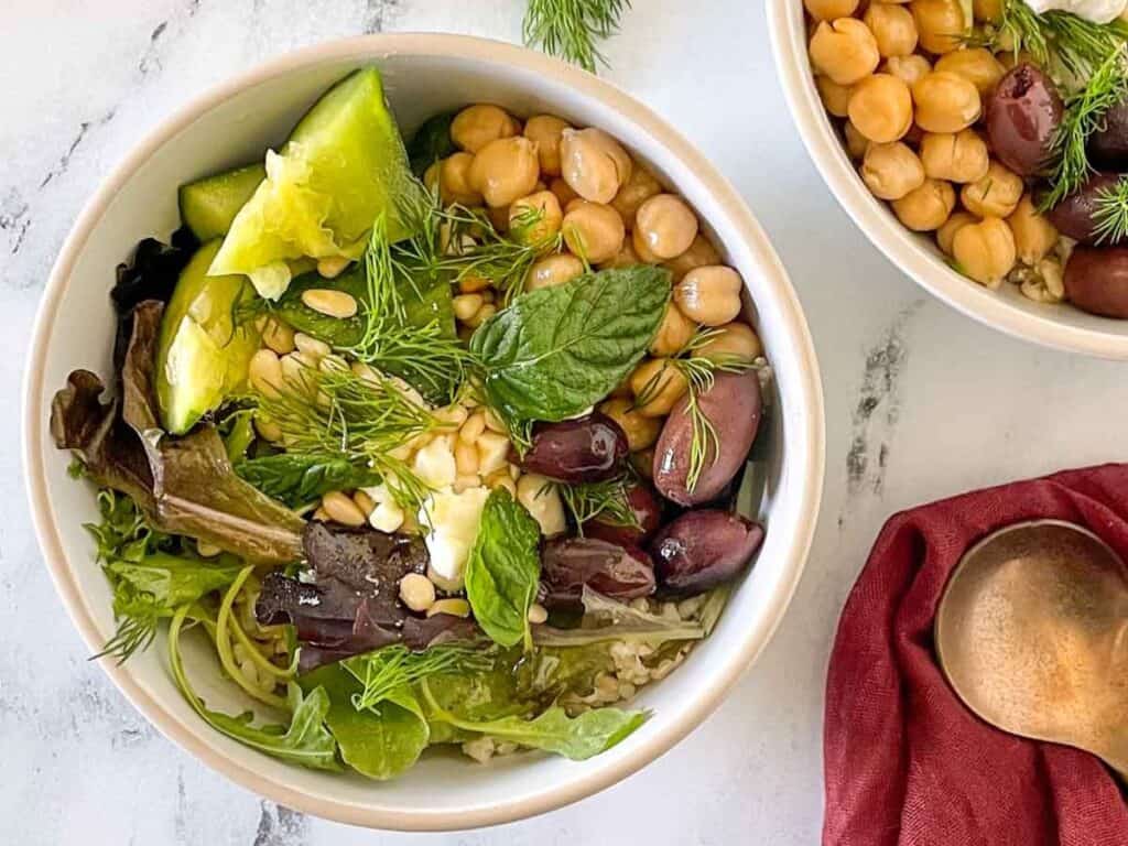 Image shows irresistible Mediterranean grain bowl.