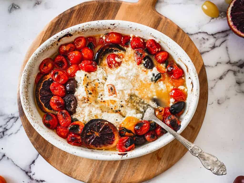 Image shows irresistible baked feta pasta.