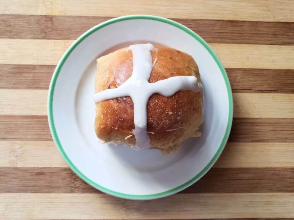 Image shows irresistible hot cross buns plated.