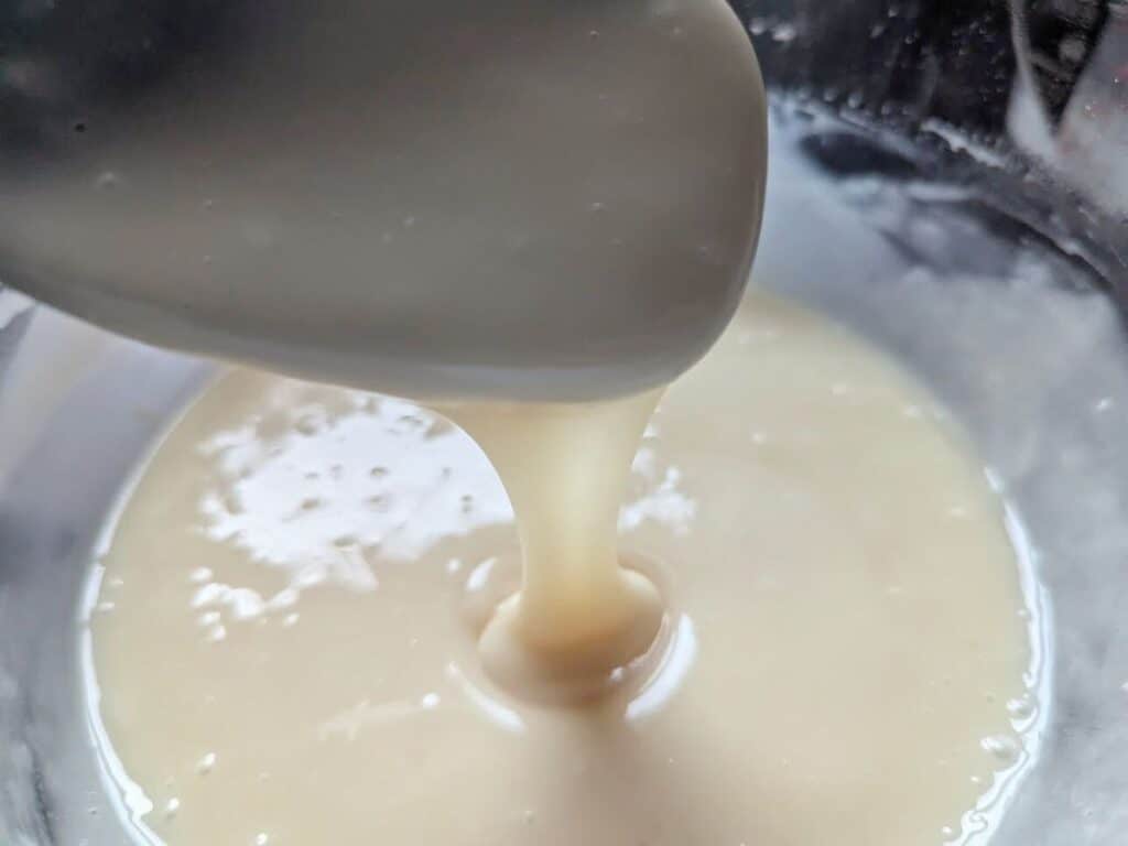 Image shows Glaze for chocolate donuts prepared in a separate container.