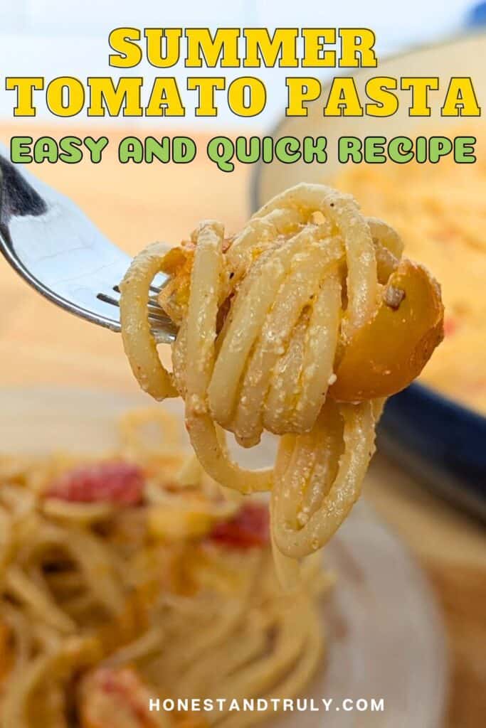 Image shows a close up of a fork holding a creamy pasta with tomatoes with the plate and the pot with more pasta behind it and the text Summer Tomato Pasta.