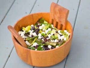 Image shows bowl of yummy goat cheese and dried cherry salad.