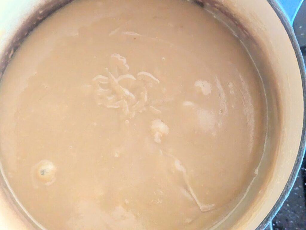 Image shows finished caramel filling in saucepan, ready to pour over shortbread base.