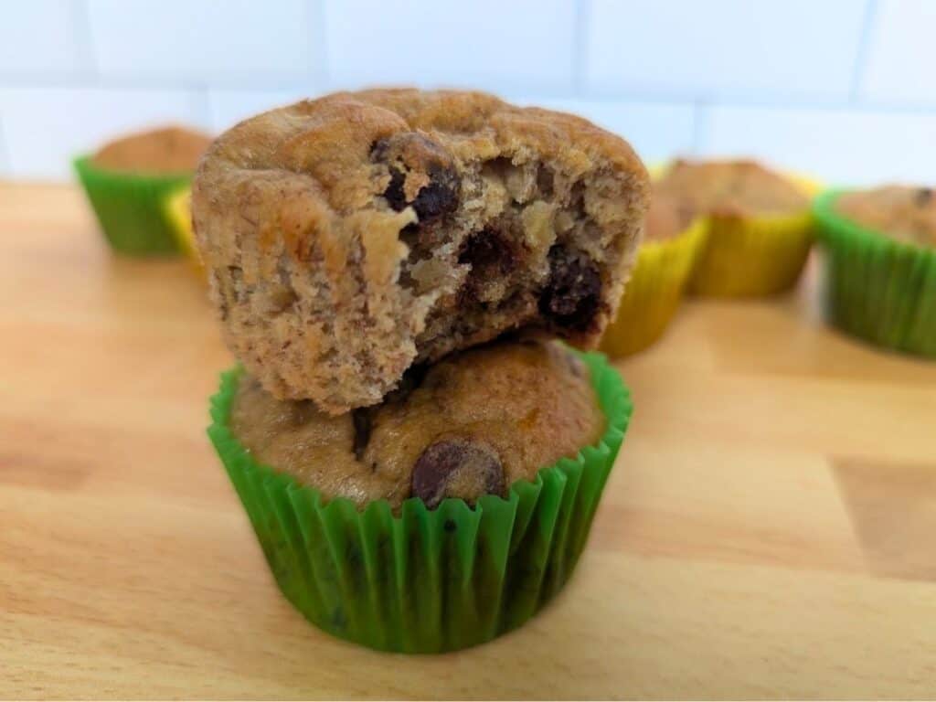 Image shows stack of delicious banana chip muffins.