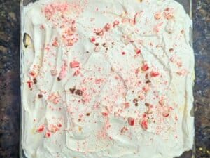 Image shows overhead view of brownie trifle with whipped topping.