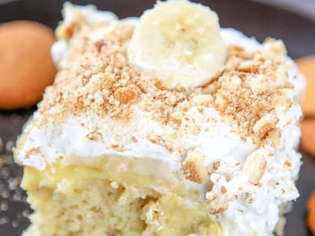 Image shows delicious banana poke cake.