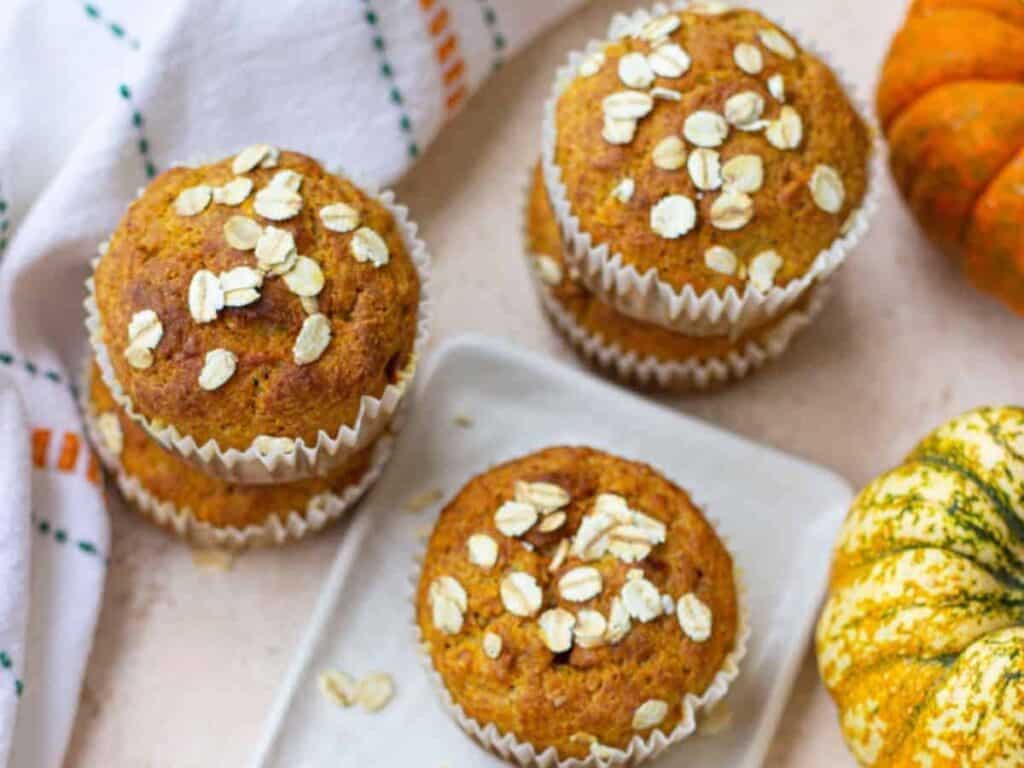 Image shows easy to make healthy pumpkin banana oat muffins.
