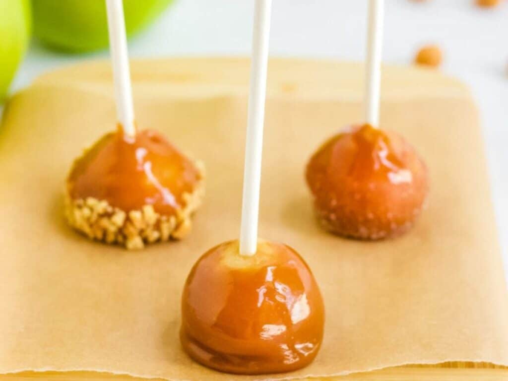 Image shows irresistible mini caramel apples.