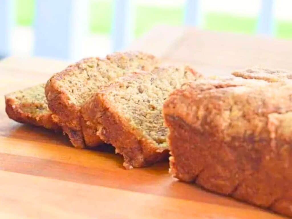 Image shows sliced simple homemade brown sugar banana bread.