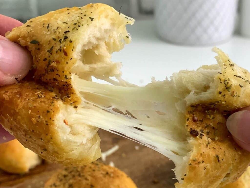 Image shows yummy garlic cheese ball.