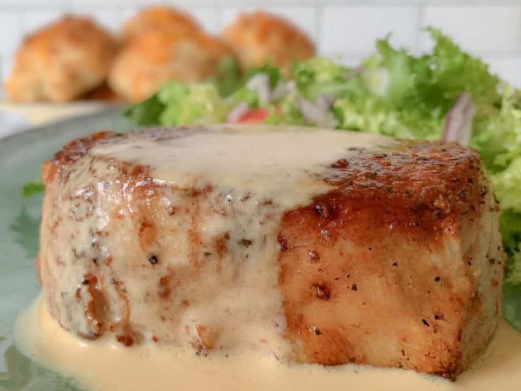 Image shows delicious juicy pan seared heritage pork chops.