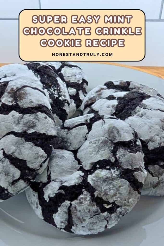 A plate of chocolate crinkle cookies covered in powdered sugar, with a sign above that reads "Super Easy Mint Chocolate Crinkle Cookie Recipe.