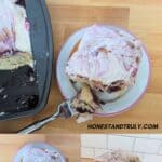A frosted berry cinnamon roll is shown on a plate with a fork, alongside a baking tray and close-up shots of the roll’s gooey, berry-filled interior.