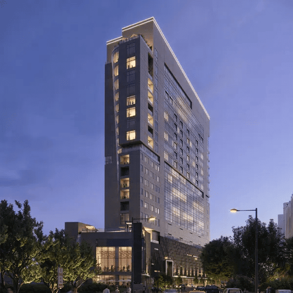 Modern luxury high-rise building in Houston for EB5 investment opportunities, showcasing upscale architecture and urban development.