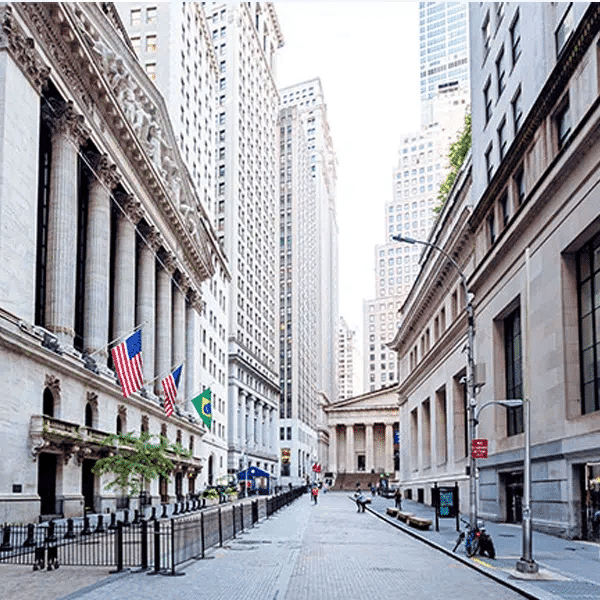 Empty financial district street in downtown Houston with historic and modern skyscrapers, promoting Houston EB5 investment opportunities in a prominent US financial hub.