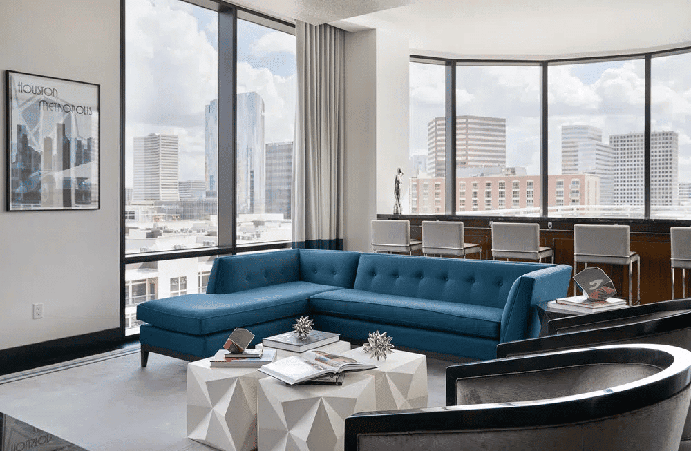 Modern Houston EB5 investment office with city skyline views and luxurious interior design.