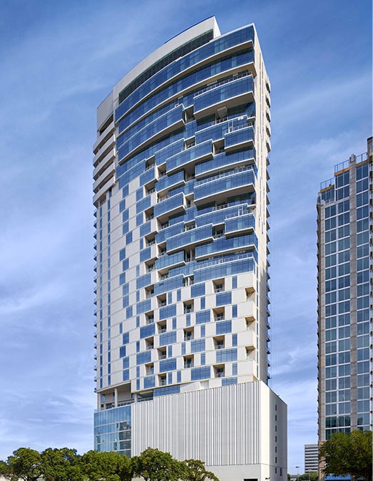 Luxurious modern high-rise building in Houston, Texas, showcasing contemporary architecture, perfect for EB5 investment opportunities, real estate, and immigration programs.