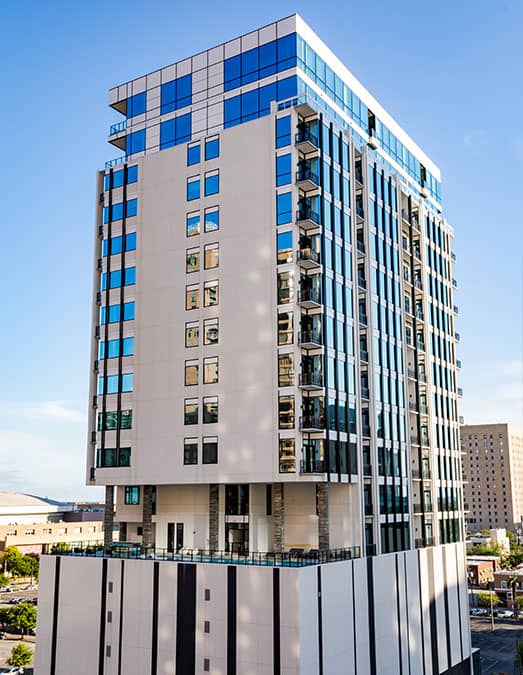 Luxury modern high-rise office building in downtown Houston, featuring glass windows and contemporary architecture, ideal for EB5 investment opportunities in Texas.