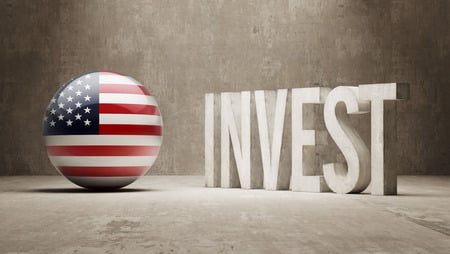 Global investment concept with American flag-themed globe and large "INVEST" text, promoting Houston EB5 immigration and investment opportunities.