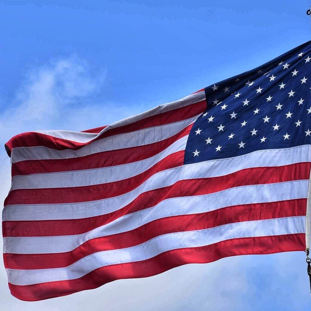 American flag flying outdoors, symbolizing patriotism and U.S. citizenship, key themes in Houston EB5 investment opportunities in the United States.