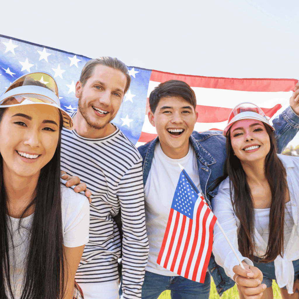 American friends celebrating with flags and patriotic hats at Houston EB5 event, showcasing multicultural community support, investment opportunities, and American pride.