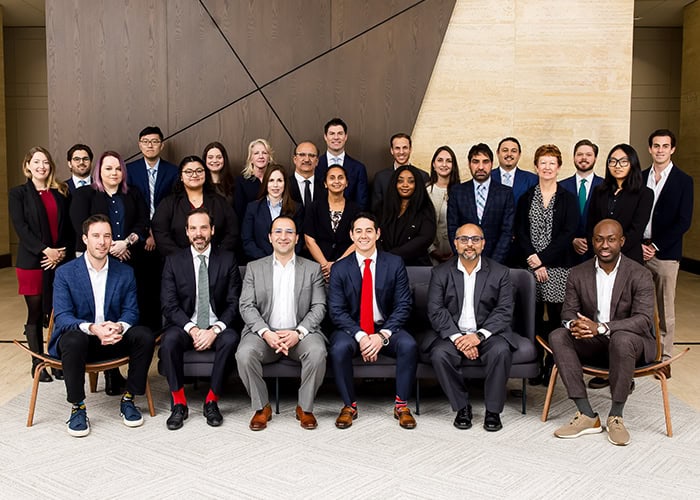 Houston EB5 investment team professional business group in corporate office environment for immigration and economic growth.