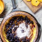dutch-baby-pancake-with-blueberries-in-a-cast-iron-pan
