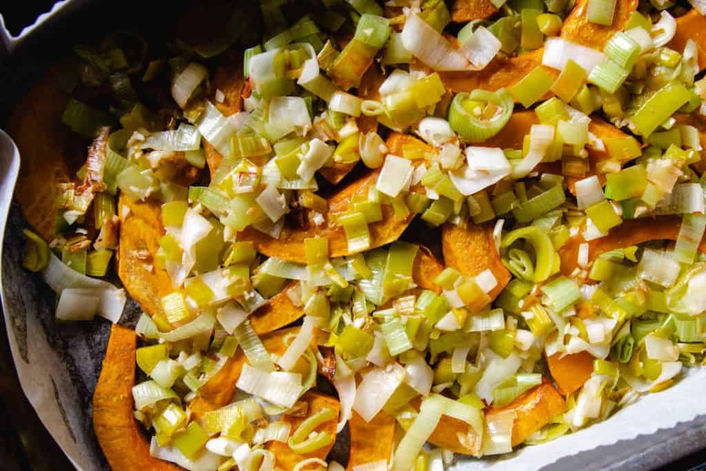 roasted squash and leeks in a baking dish