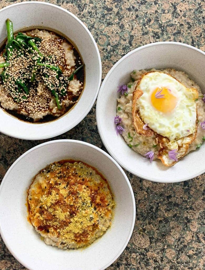 three bowls of savoury porridge with different toppings