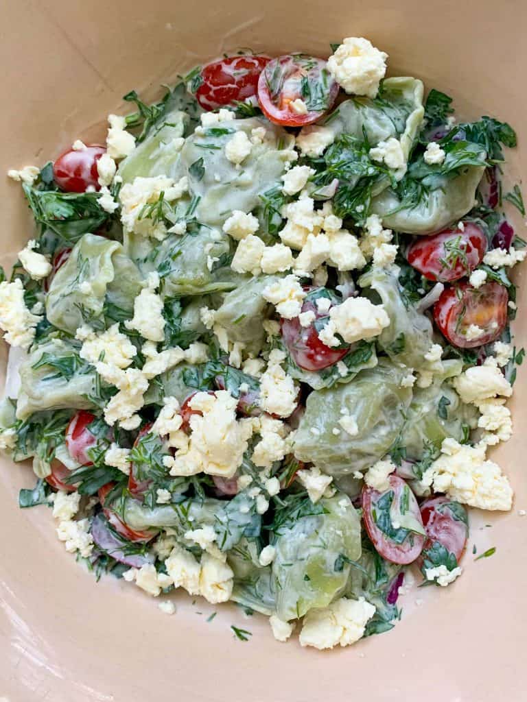close up of a summer tortellini salad with feta cheese.