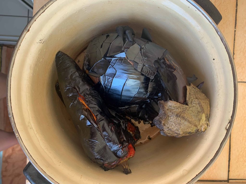roasted eggplant and red pepper in a pot.
