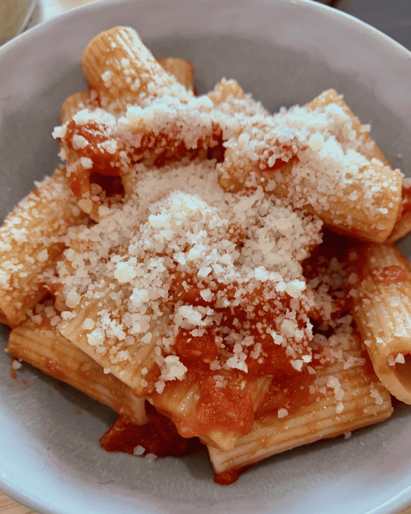Rigatoni tossed in marinara sauce with parmesan cheese