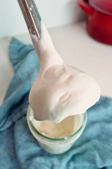 An immersion blender after blending mayonnaise.