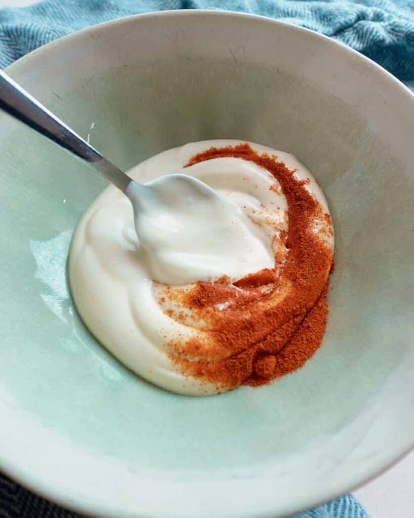 A bowl of mayonnaise with smoked paprika.