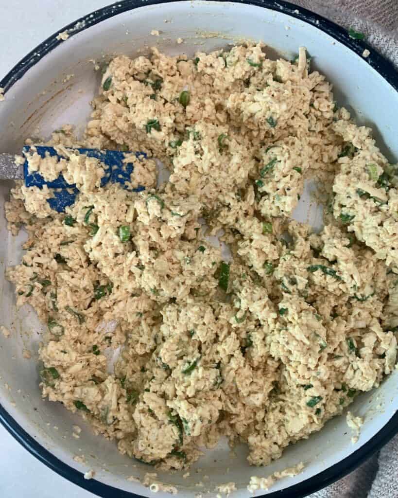 Tofu salad mixture in a white bowl.