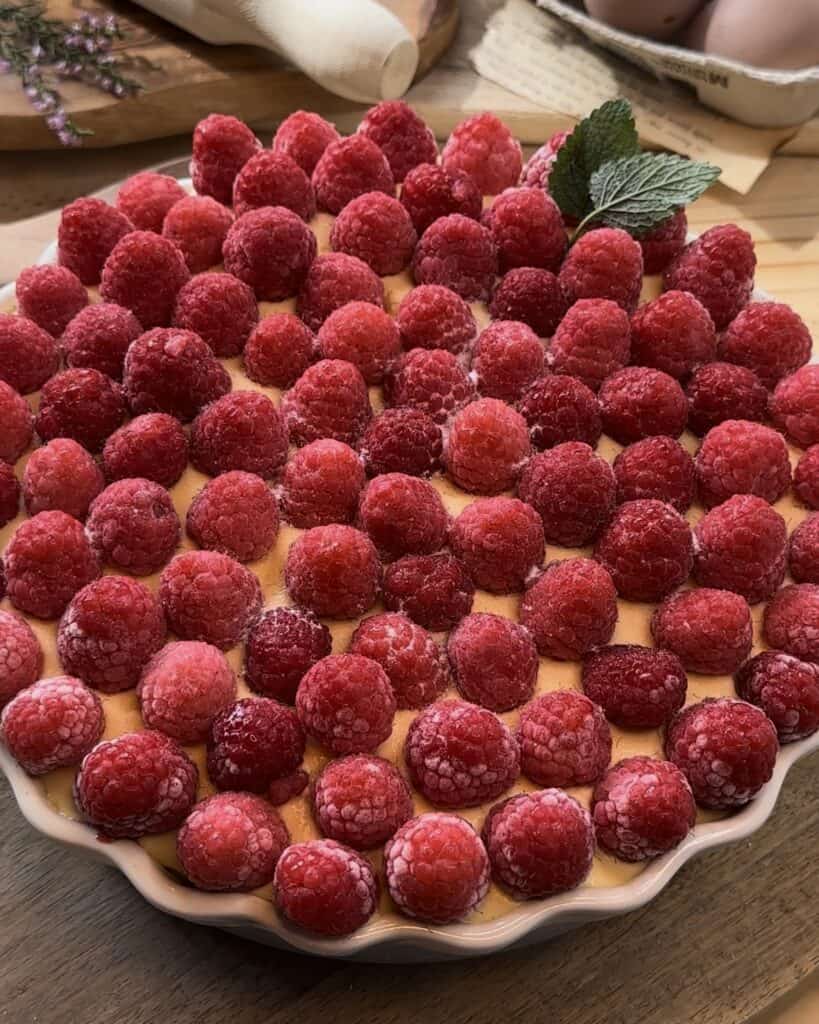 Homemade raspberry tiramisu, layered with soft biscuit, mascarpone cream, raspberry jam and fresh raspberries, creating a sweet and tangy twist on the classic dessert