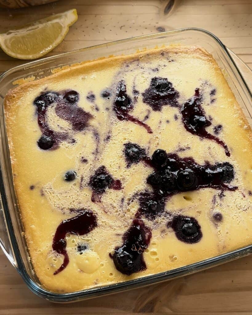 Freshly baked irresistible blueberry cheesecake bars cooling to perfection, ready for a delightful serving