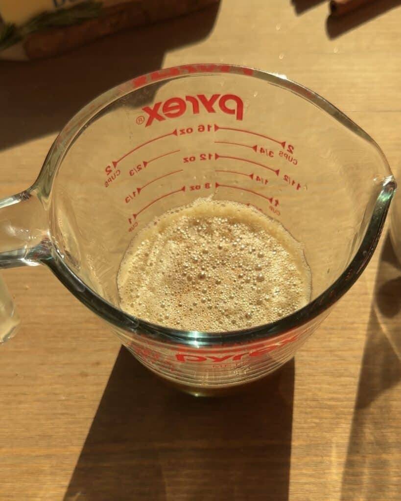 Brown butter in a Pyrex dish, enhancing the flavor for the Christmas brownie batter, creating a rich and decadent treat for the holiday season.