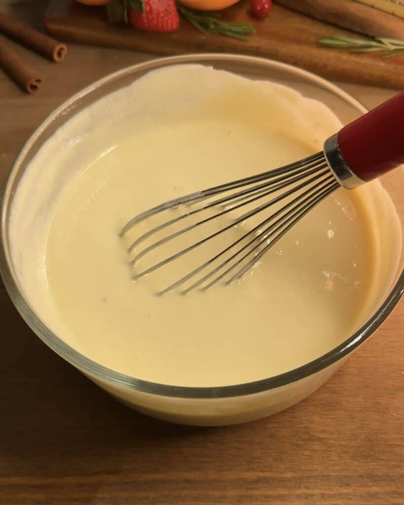 Creamy cheesecake batter in a bowl, ready to be used for making Churro cheesecake bars