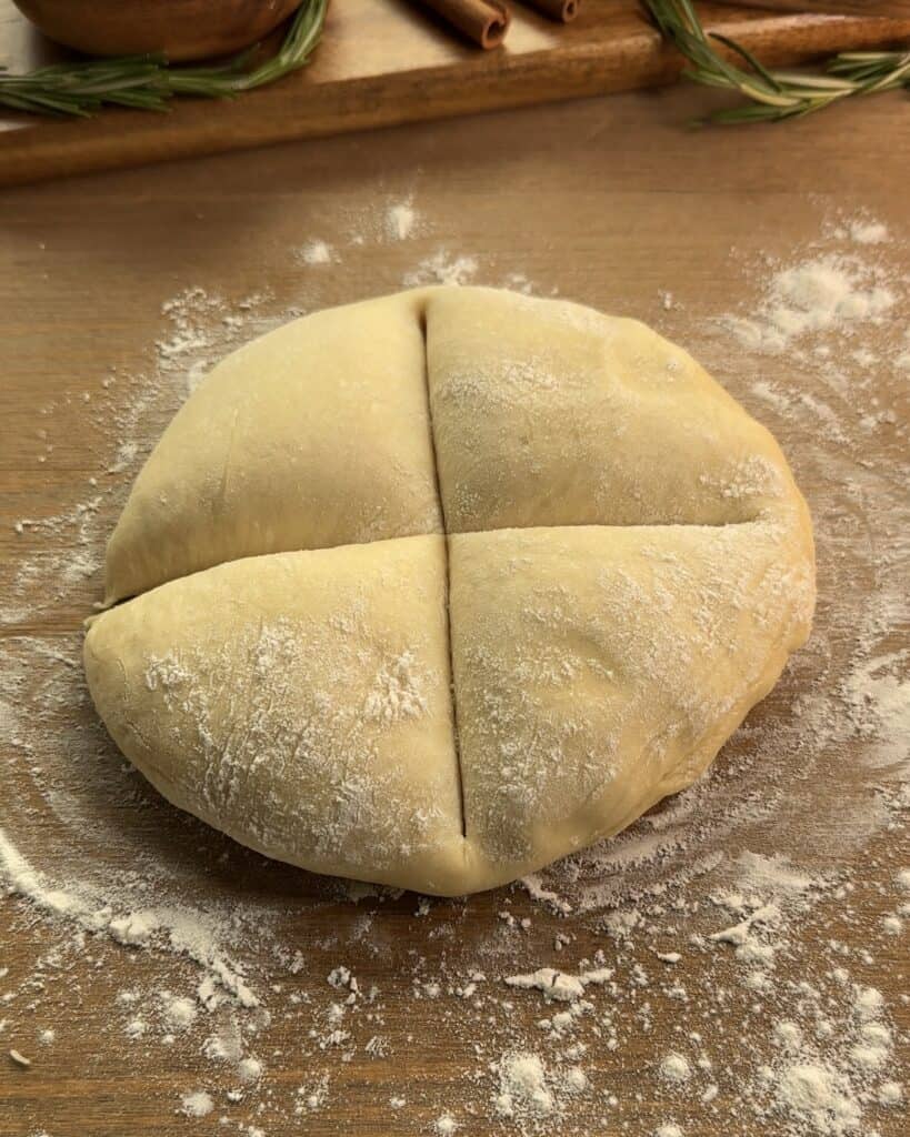 Dividing the dough into four equal parts to prepare Nutella-stuffed brioche