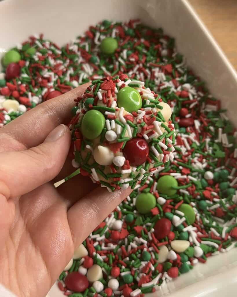 Adding colorful festive confetti sprinkles to the batter for the Festive Holiday Cookies