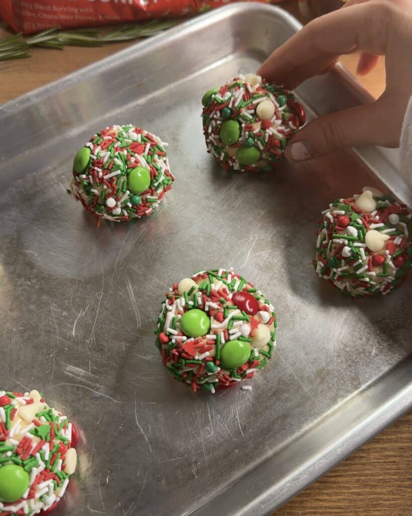 Festive Holiday Cookies arranged on a baking sheet, decorated with colorful confetti sprinkles, ready to be baked