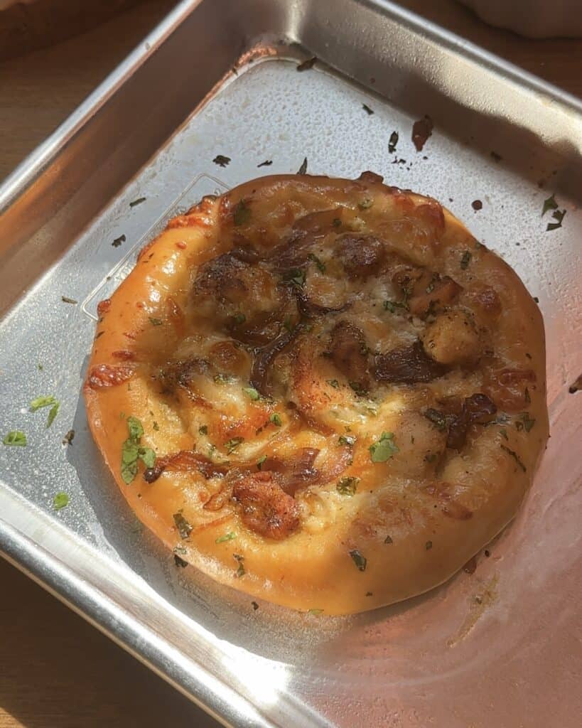 Freshly baked chicken pizza straight out of the oven, golden and bubbly with melted cheese, ready to be served