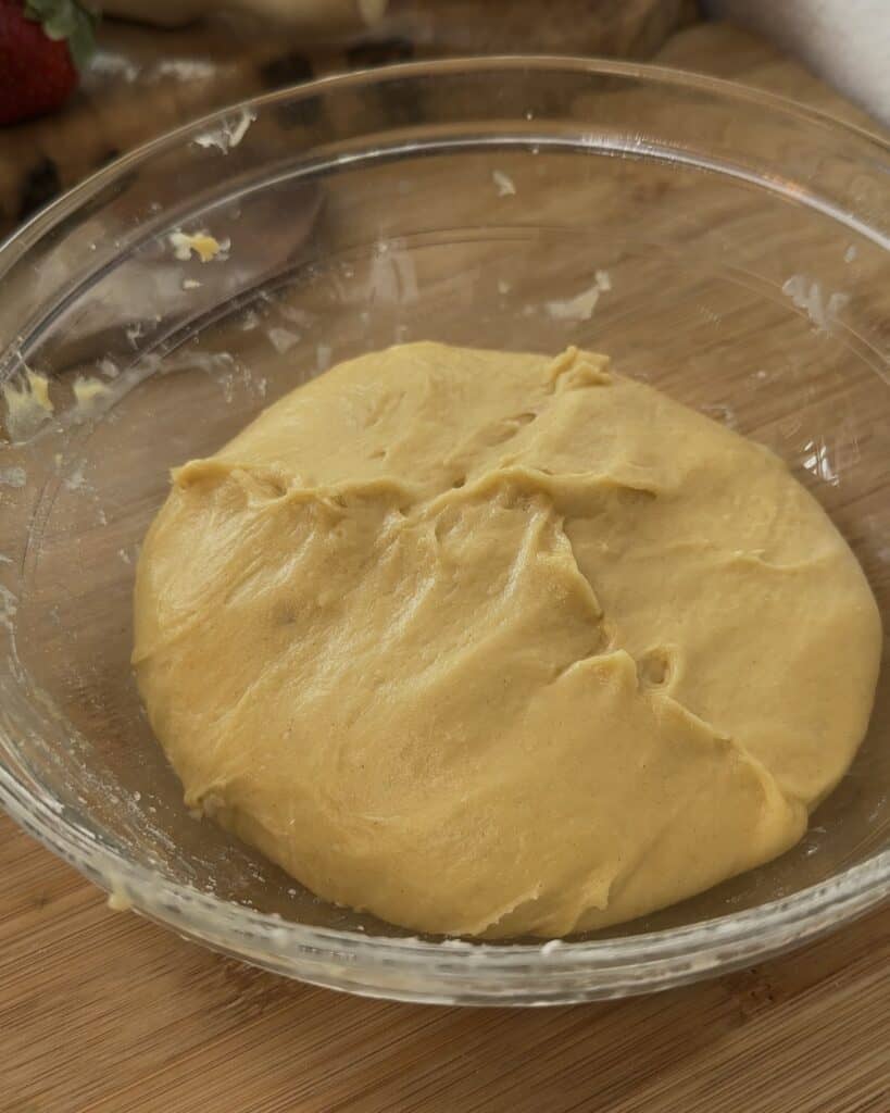 Nutella Bomb Donut dough after the first proofing, risen and airy, ready to be shaped into donuts for frying or baking.