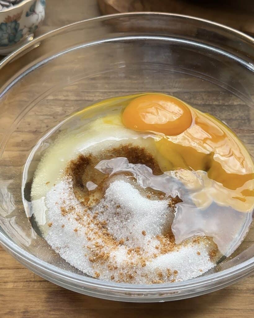 Bowl with eggs and sugars before being mixed for the cookie dough Nutella pie.