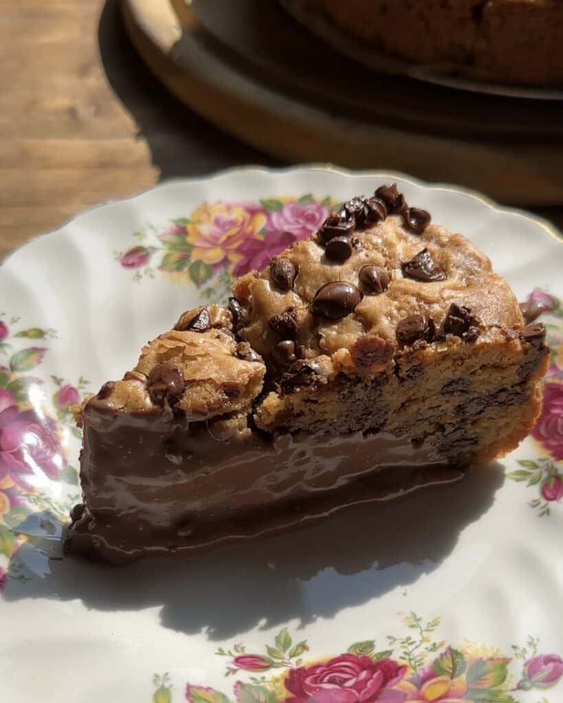 Close-up of a slice of Nutella Stuffed Cookie Pie, showing the rich, gooey Nutella center surrounded by soft, golden cookie dough.