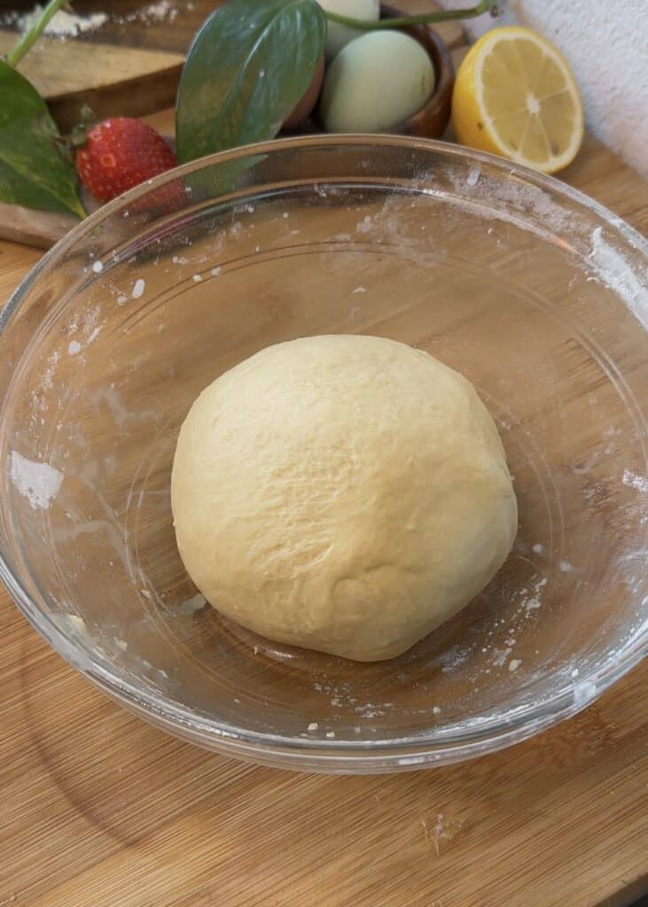 Kneaded dough for Nutella heart donuts resting in a bowl before proofing, perfect for Valentine’s Day desserts.