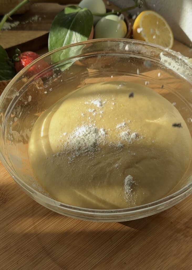 Proofed dough for Nutella heart donuts doubled in size, ready for shaping into Valentine’s Day treats.