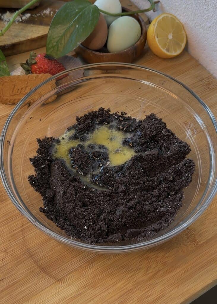 Crushed Oreos and melted butter for no-bake Nutella cheesecake crust.